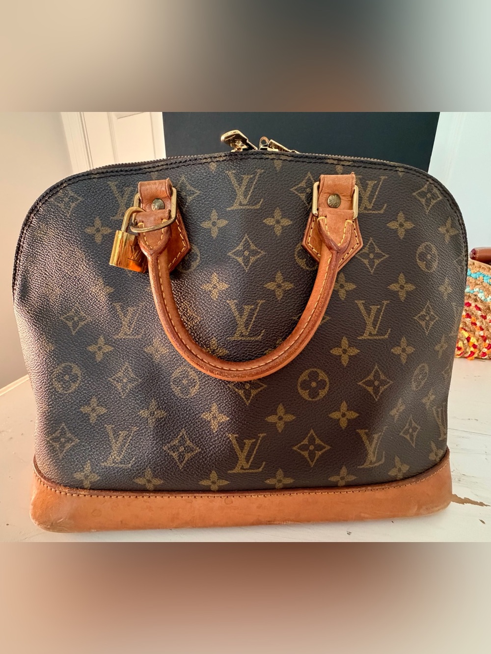 Louis Vuitton Alma Monogram Satchel in Brown and Tan with Gold Hardware